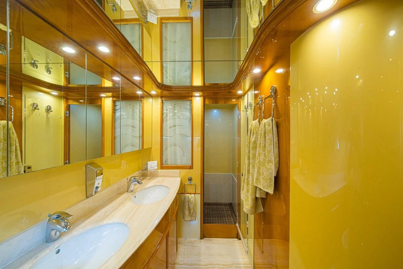 The yacht's bathroom features elegant fixtures and a luxurious design with ample lighting. aboard ASTONDOA 82 GLX Yacht for Sale