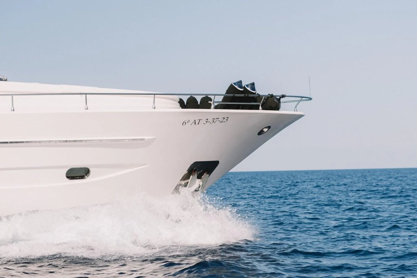 The sleek bow of a yacht cuts through the water, showcasing its elegant design. aboard ASTONDOA 82 GLX Yacht for Sale