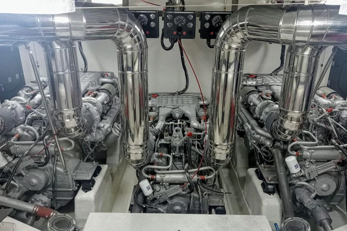 The image showcases the meticulously maintained engine room of the yacht, highlighting its powerful machinery. aboard ASTONDOA 82 GLX Yacht for Sale
