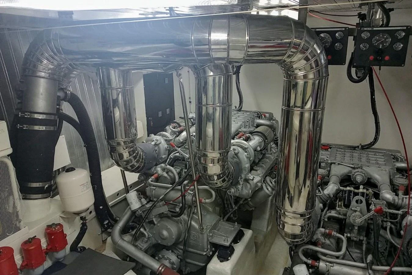 The image showcases the yacht's engine room with its intricate machinery and polished components. aboard ASTONDOA 82 GLX Yacht for Sale