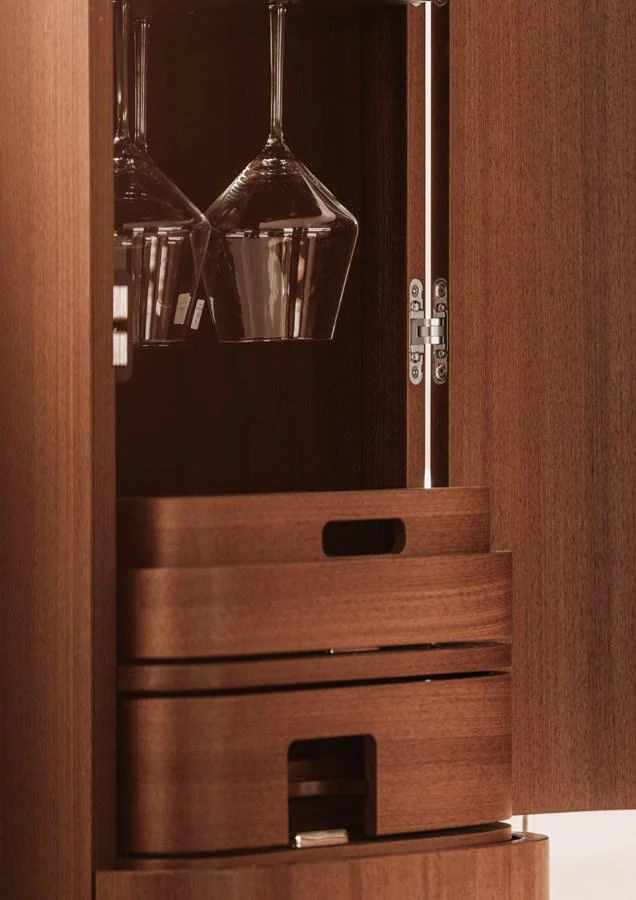 A close-up of a wooden cabinet with neatly stored glassware and drawers. aboard 2026 YYACHTS Y8 Yacht for Sale