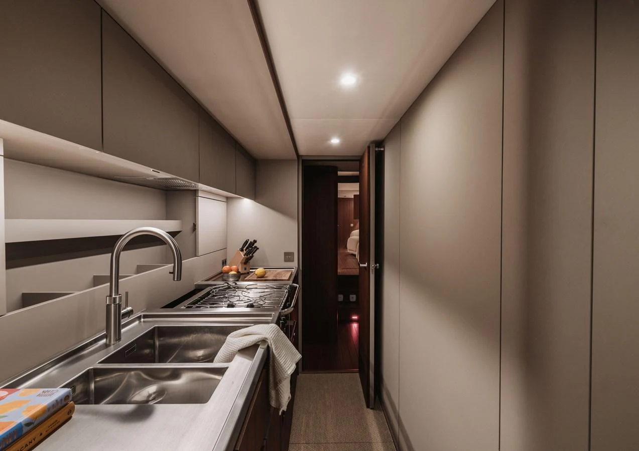 A sleek and modern galley with stainless steel appliances and ample counter space. aboard 2026 YYACHTS Y8 Yacht for Sale