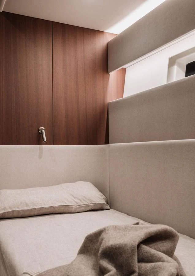 A cozy cabin with a comfortable bed and modern design elements. aboard 2026 YYACHTS Y8 Yacht for Sale