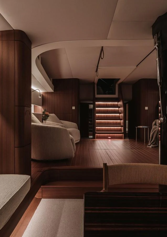 The yacht's interior features a cozy and elegant living area with warm lighting and modern furnishings. aboard 2026 YYACHTS Y8 Yacht for Sale