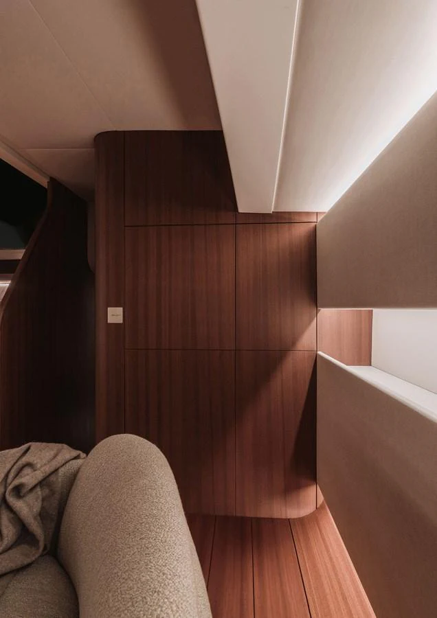 A cozy and modern interior space with warm wooden paneling and soft lighting. aboard 2026 YYACHTS Y8 Yacht for Sale