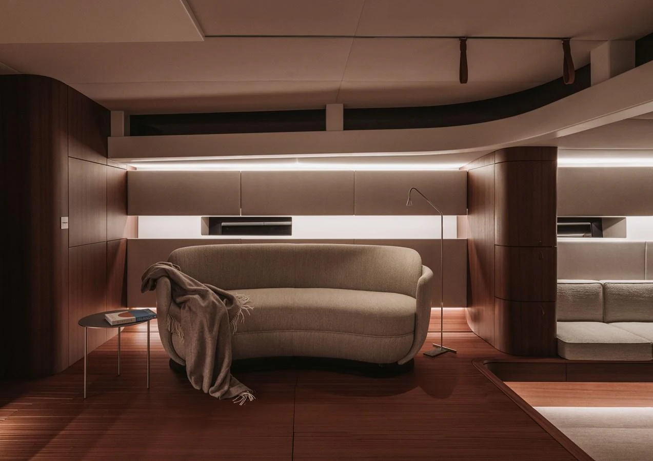 The yacht's interior features a cozy seating area with modern furnishings and warm lighting. aboard 2026 YYACHTS Y8 Yacht for Sale