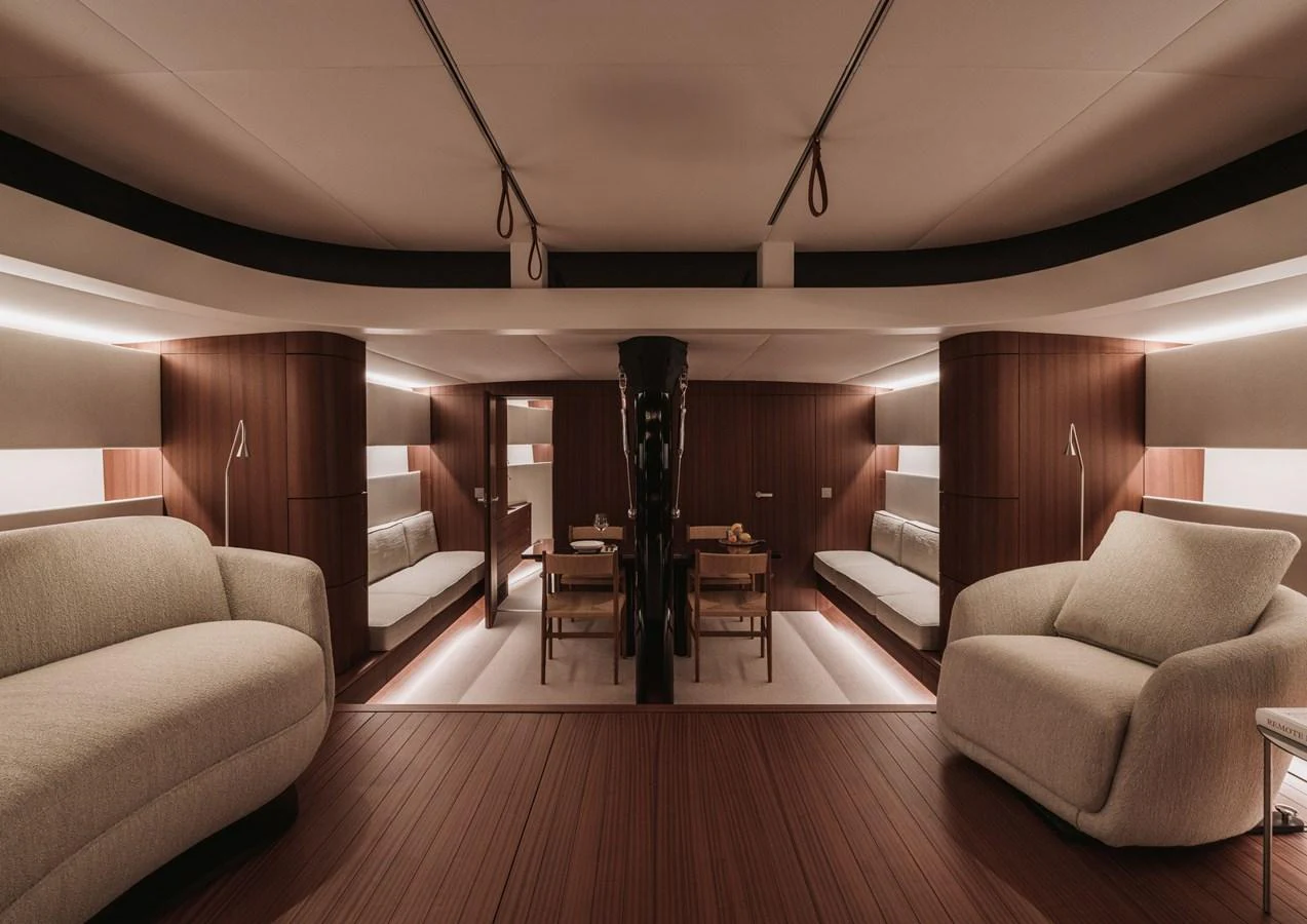 The yacht's interior features a spacious and elegantly designed seating area with plush furniture and warm lighting. aboard 2026 YYACHTS Y8 Yacht for Sale