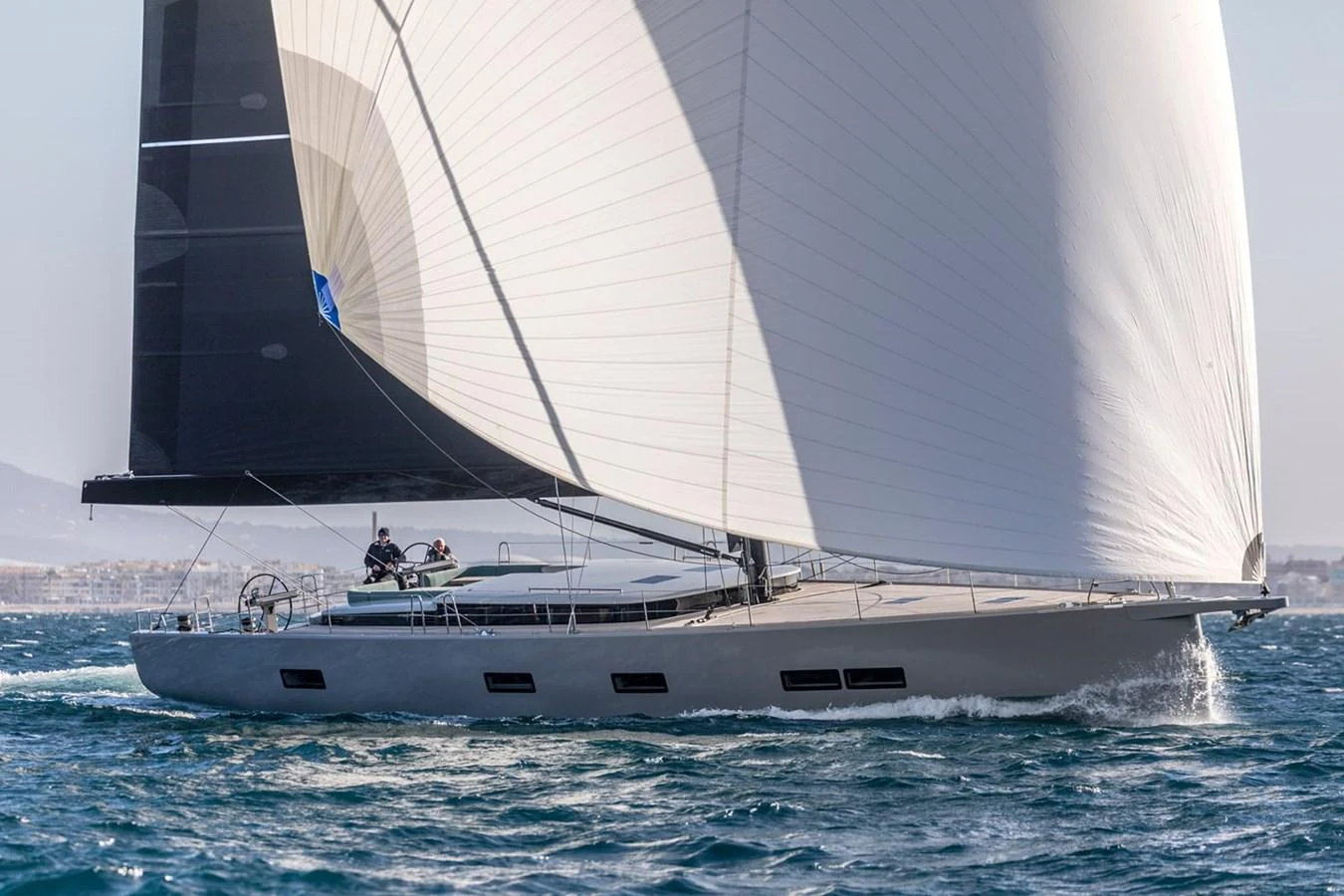 A sleek sailing yacht glides gracefully on the water with its sails fully unfurled. aboard 2026 YYACHTS Y7 Yacht for Sale