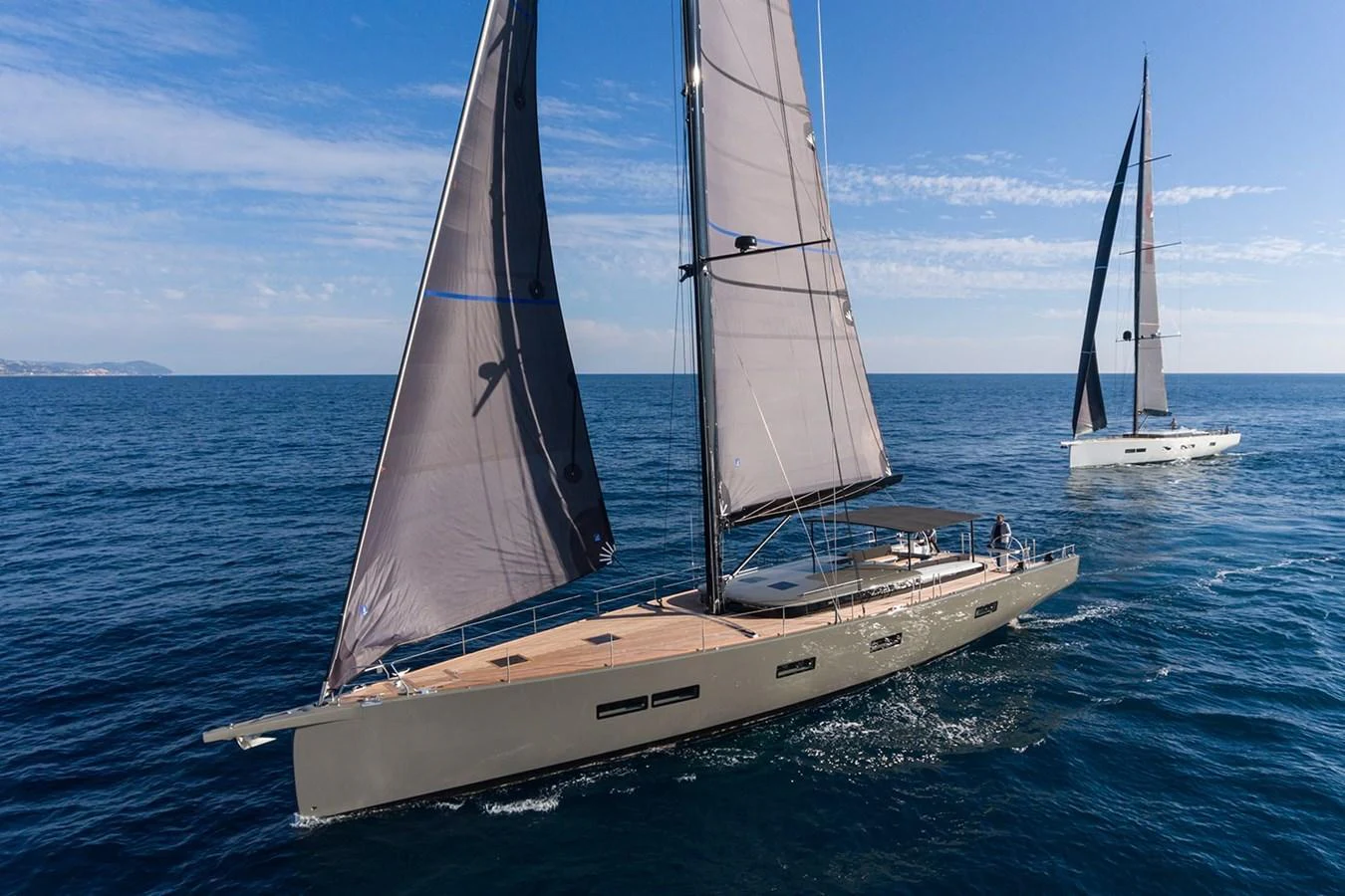 A sleek sailing yacht glides gracefully on the open sea under full sail. aboard 2026 YYACHTS Y7 Yacht for Sale