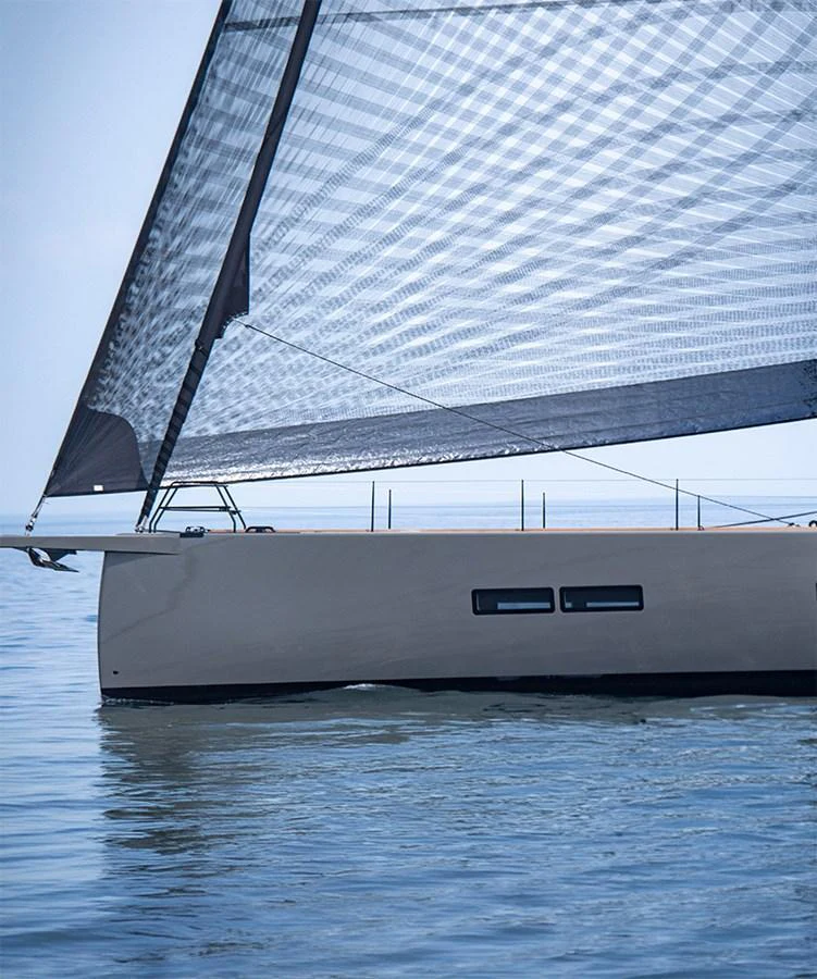 A sleek sailing yacht glides gracefully on calm waters, showcasing its modern design and impressive sail. aboard 2026 YYACHTS Y7 Yacht for Sale