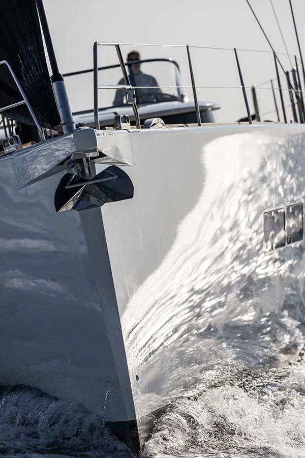 A sleek yacht cuts through the water, showcasing its polished hull and modern design. aboard 2026 YYACHTS Y7 Yacht for Sale