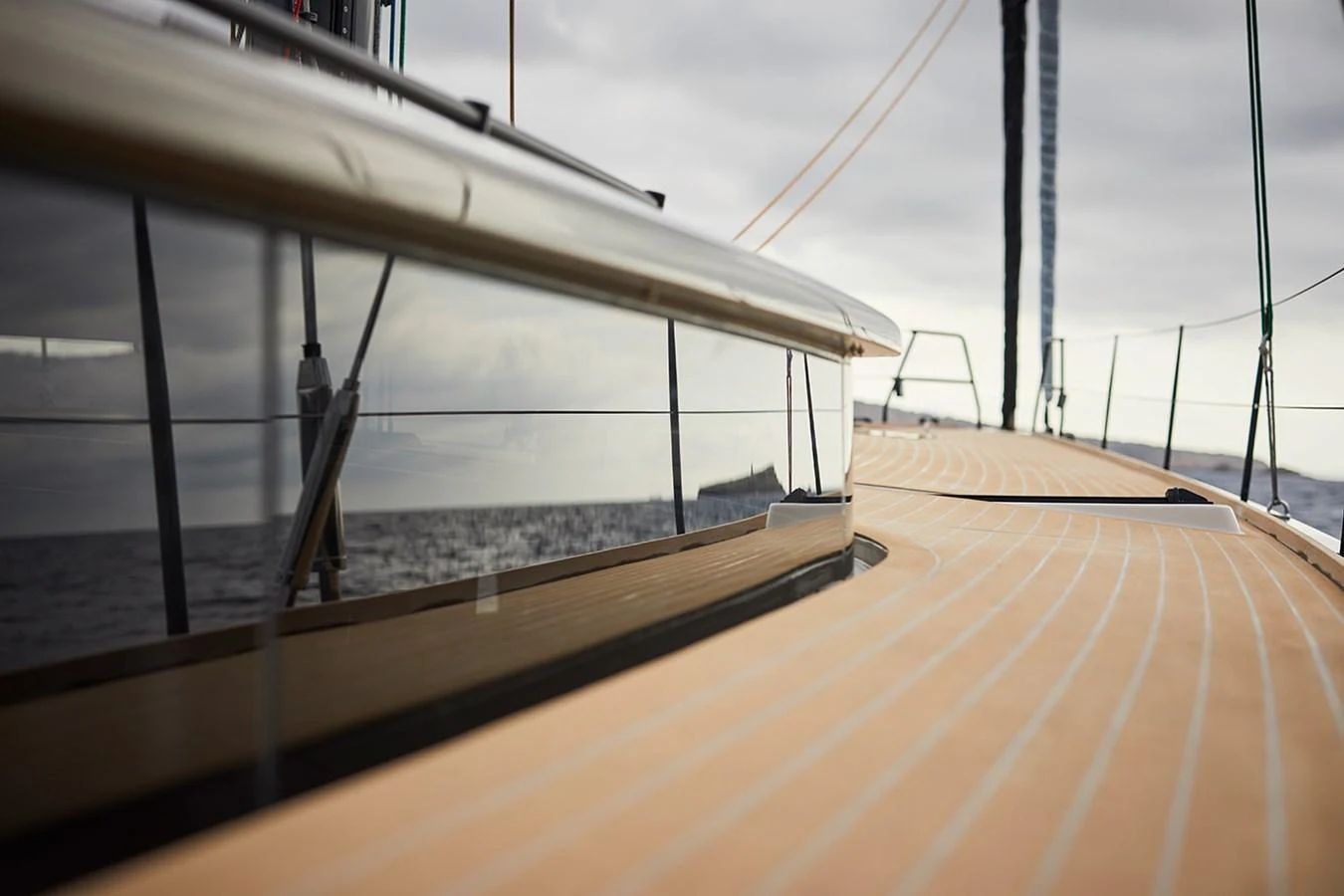A close-up view of the yacht's sleek deck and reflective windows, showcasing its modern design. aboard 2026 YYACHTS Y7 Yacht for Sale