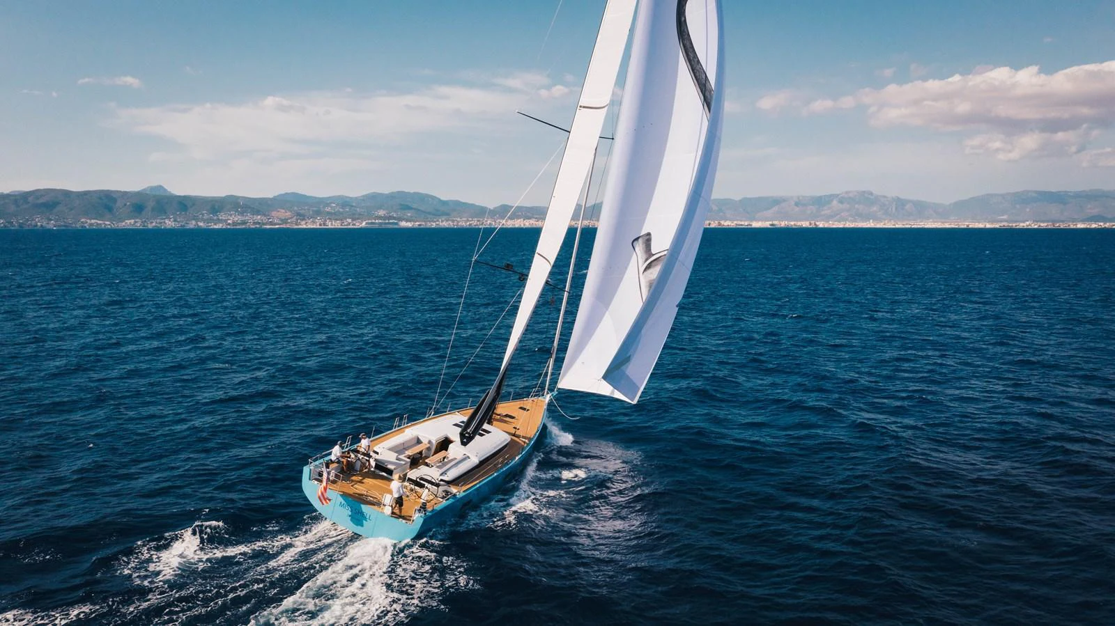 A sleek sailing yacht glides gracefully across the open sea under full sail. aboard 2026 YYACHTS Y7 Yacht for Sale