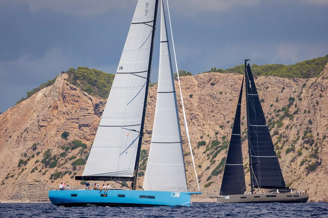 A sleek sailing yacht glides gracefully on the water with its sails fully extended. aboard 2026 YYACHTS Y7 Yacht for Sale