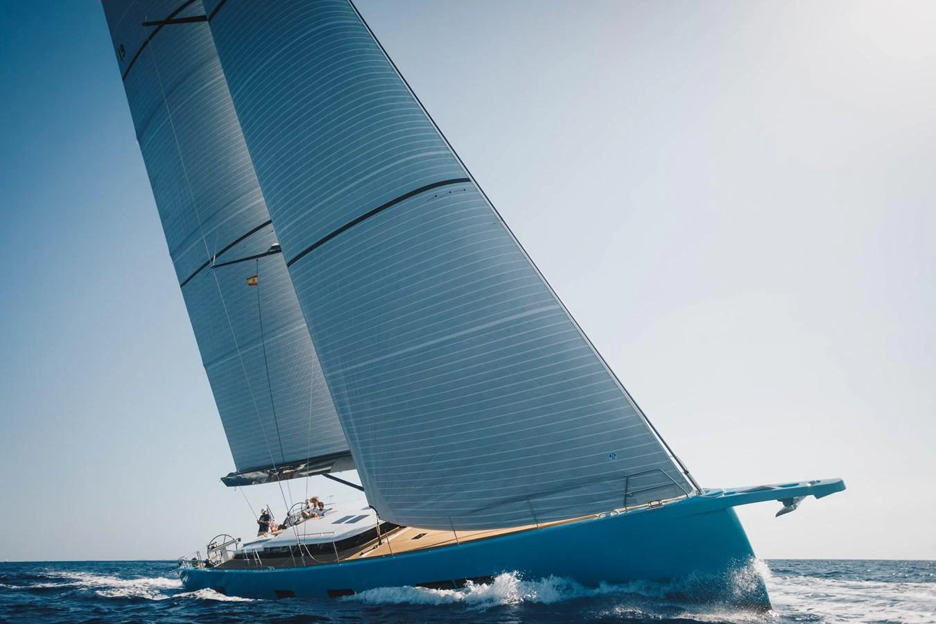 A sleek sailing yacht glides gracefully on the open sea with its sails fully extended. aboard 2026 YYACHTS Y7 Yacht for Sale