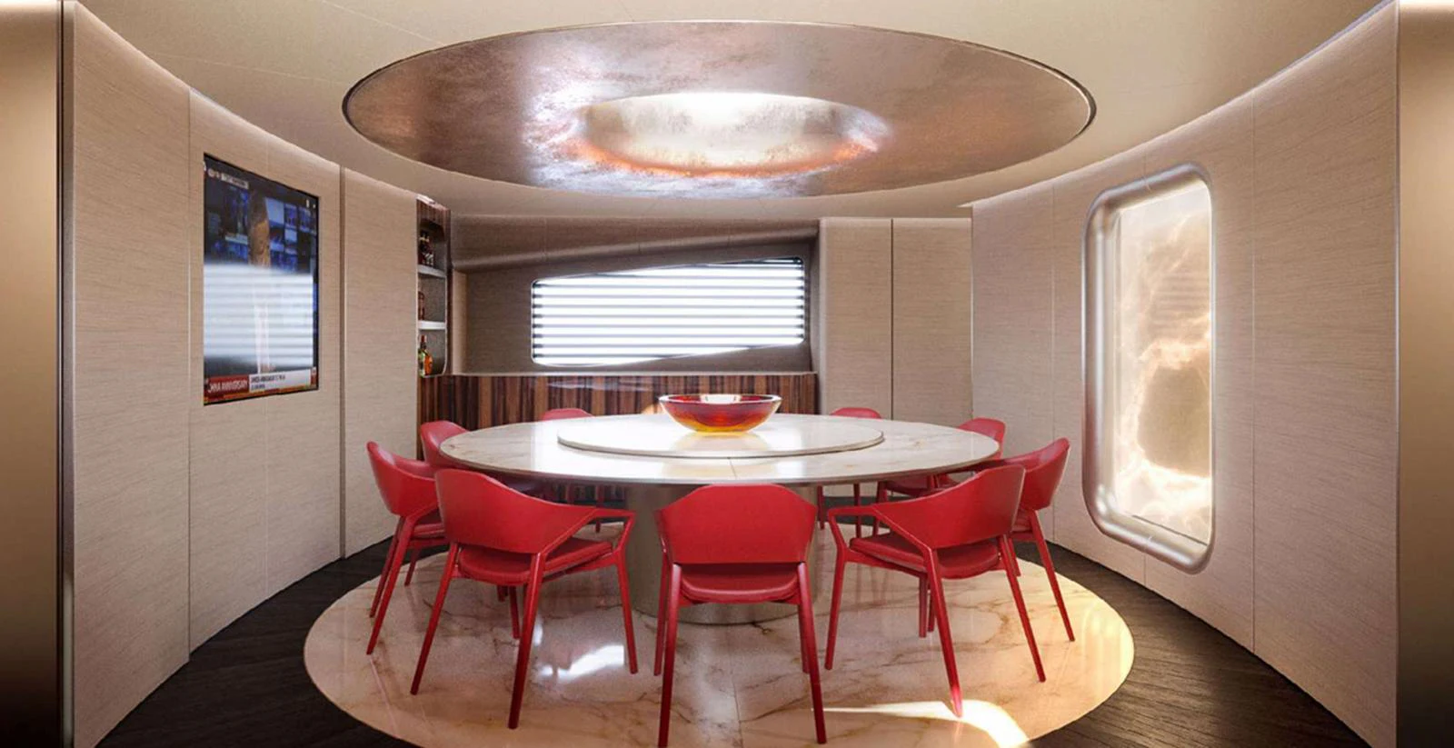 The yacht's dining area features a modern design with a round table and vibrant red chairs. aboard T-EVO 120 Yacht for Sale