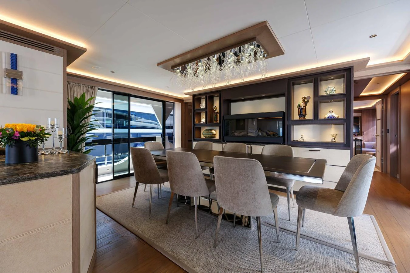 The yacht's dining area features elegant seating and sophisticated decor. aboard 2024 SIRENA 88 Yacht for Sale