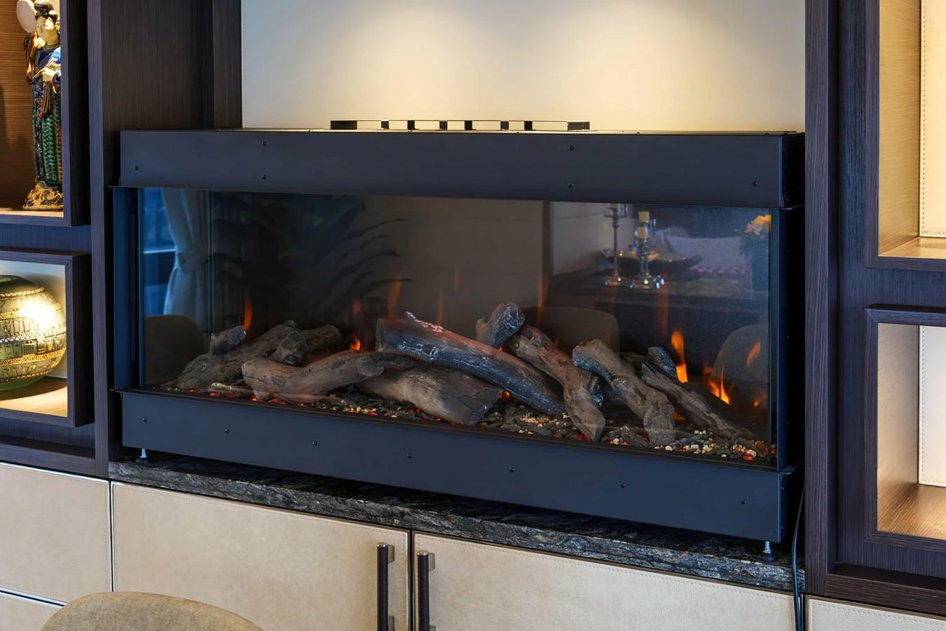 The image showcases a modern electric fireplace within a yacht's interior, surrounded by elegant cabinetry. aboard 2024 SIRENA 88 Yacht for Sale