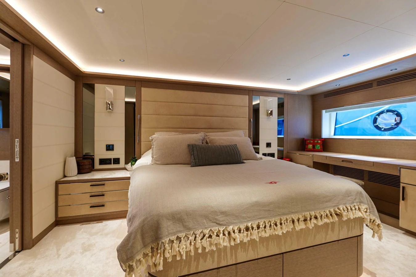 The master stateroom features a luxurious bed with elegant decor and ample natural light. aboard 2024 SIRENA 88 Yacht for Sale