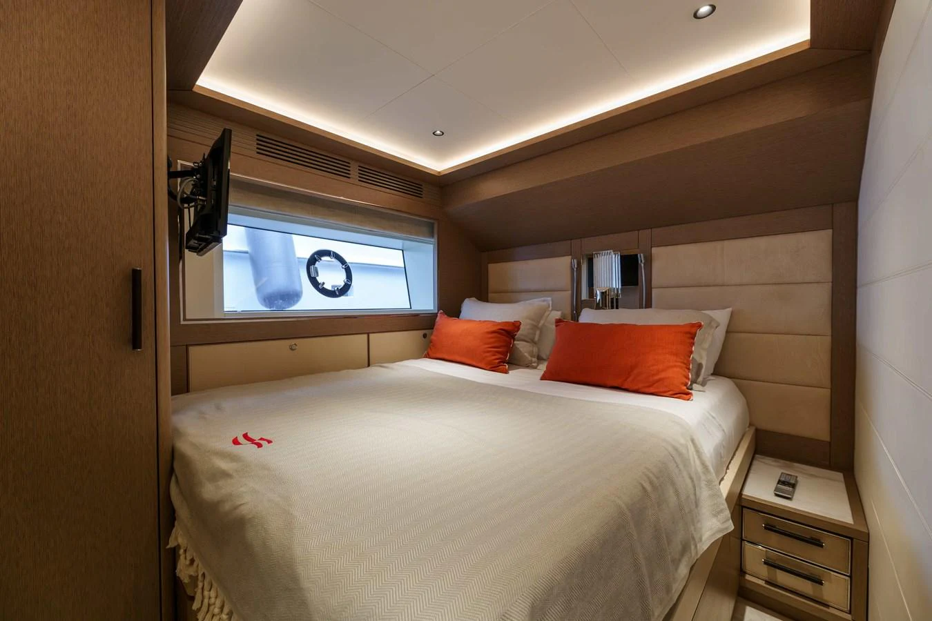 A cozy stateroom with a large bed and modern lighting. aboard 2024 SIRENA 88 Yacht for Sale
