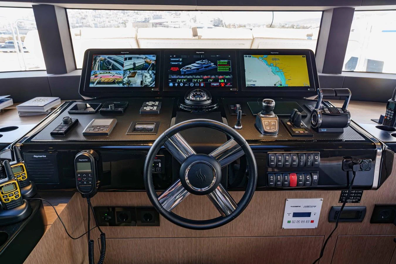 The helm station features advanced navigation and communication equipment for optimal control. aboard 2024 SIRENA 88 Yacht for Sale