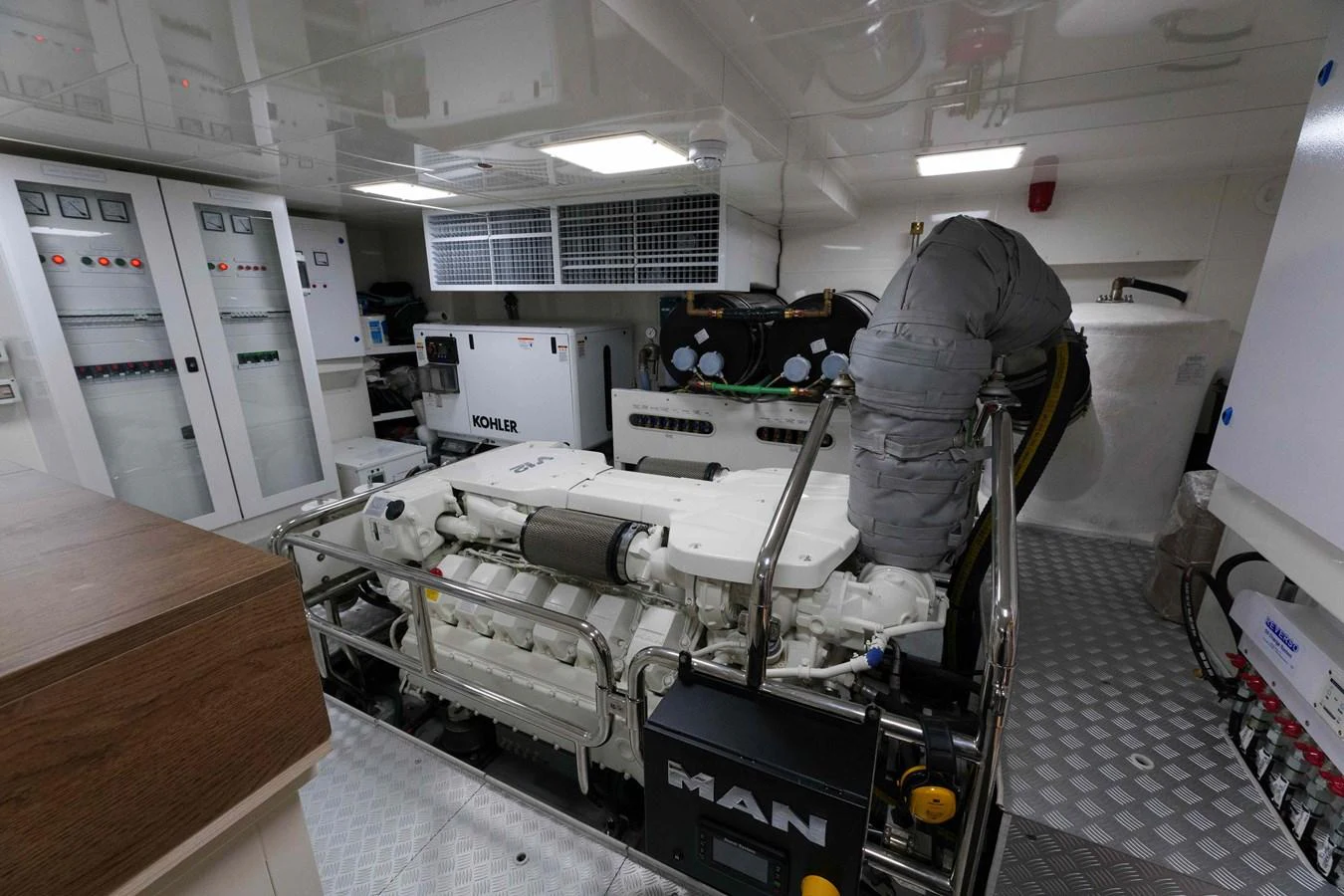 The yacht's engine room showcases advanced machinery and clean organization. aboard 2024 SIRENA 88 Yacht for Sale