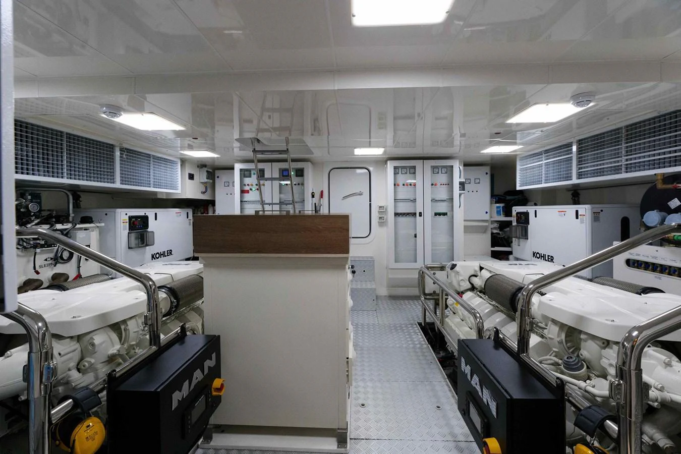 The engine room showcases powerful machinery and a clean, organized layout. aboard 2024 SIRENA 88 Yacht for Sale