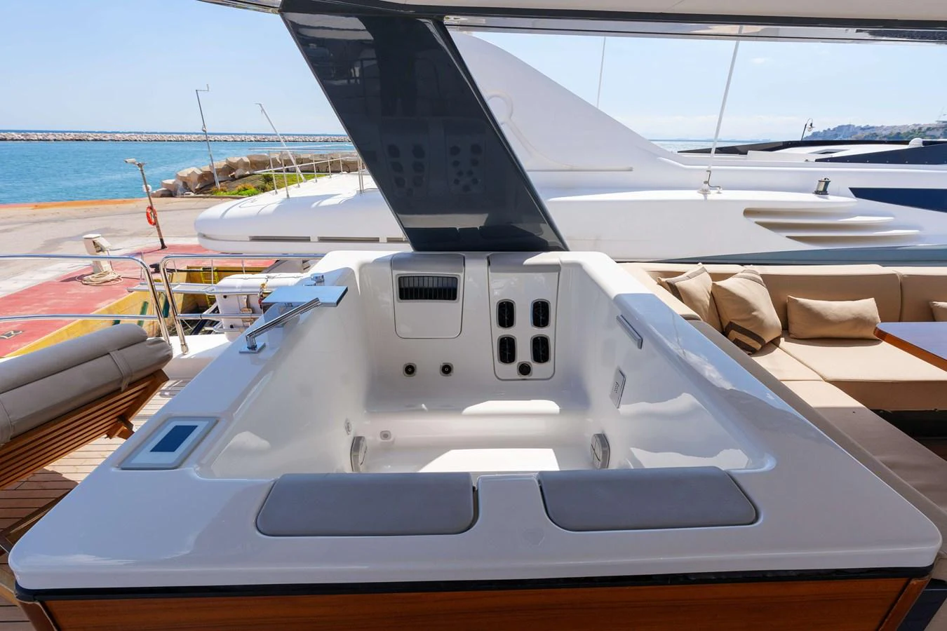 The yacht features a luxurious jacuzzi on the deck, perfect for relaxation with a view of the sea. aboard 2024 SIRENA 88 Yacht for Sale