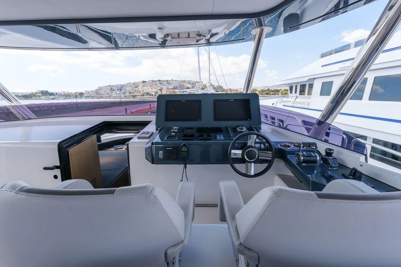 The helm station offers a modern and well-equipped control area with panoramic views. aboard 2024 SIRENA 88 Yacht for Sale