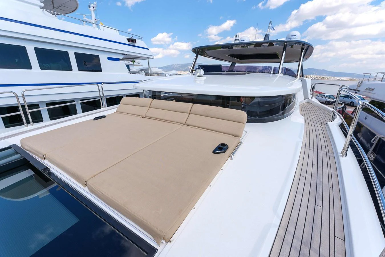 The foredeck features a spacious sunpad for lounging under the open sky. aboard 2024 SIRENA 88 Yacht for Sale