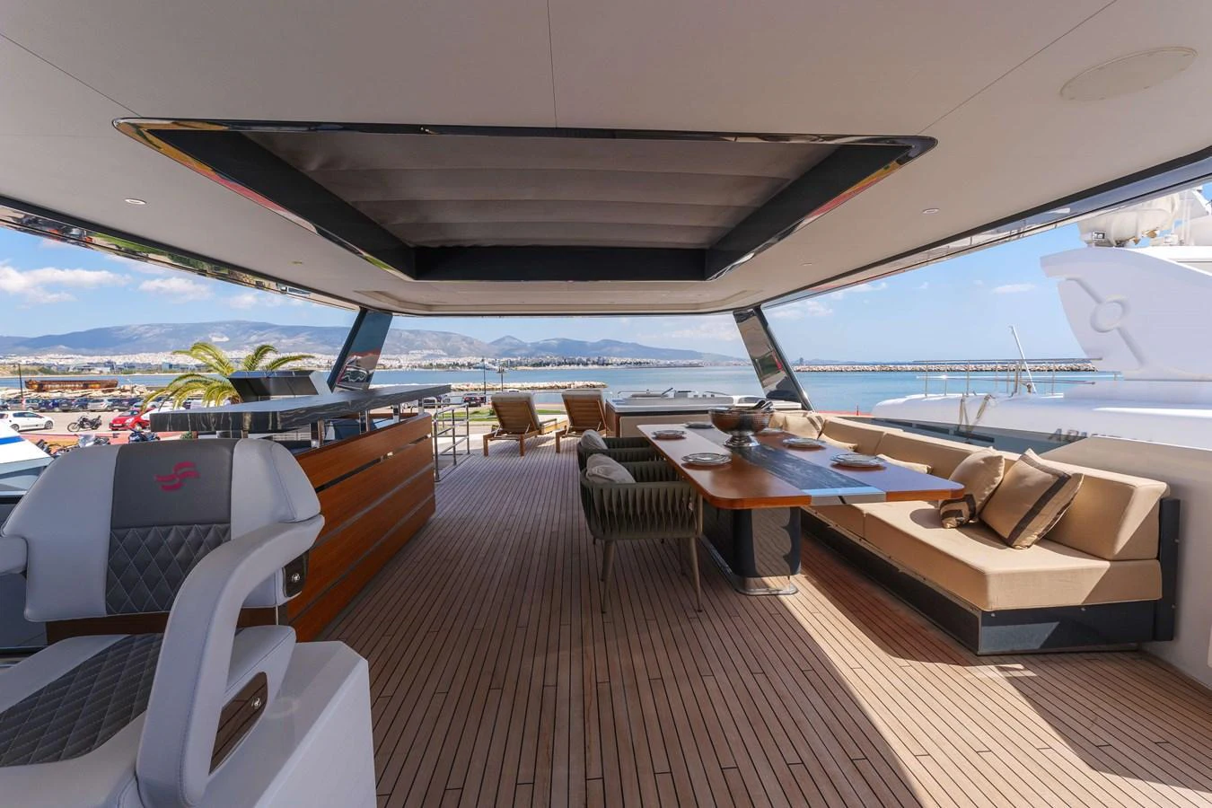 The flybridge offers a spacious and luxurious outdoor living area with ample seating and stunning views. aboard 2024 SIRENA 88 Yacht for Sale