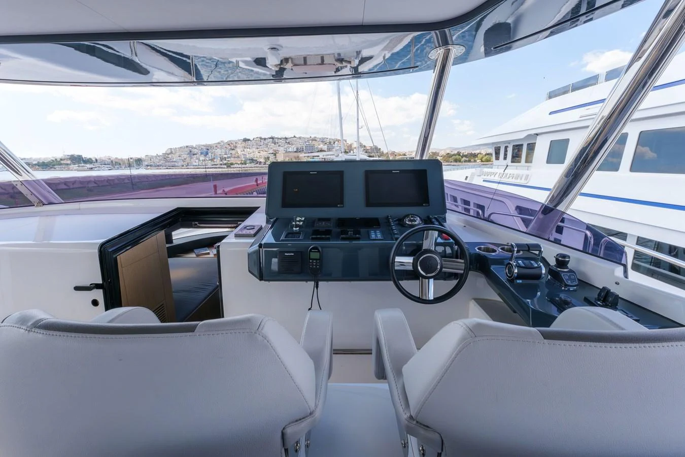 The helm station offers a modern and well-equipped control area with panoramic views. aboard 2024 SIRENA 88 Yacht for Sale