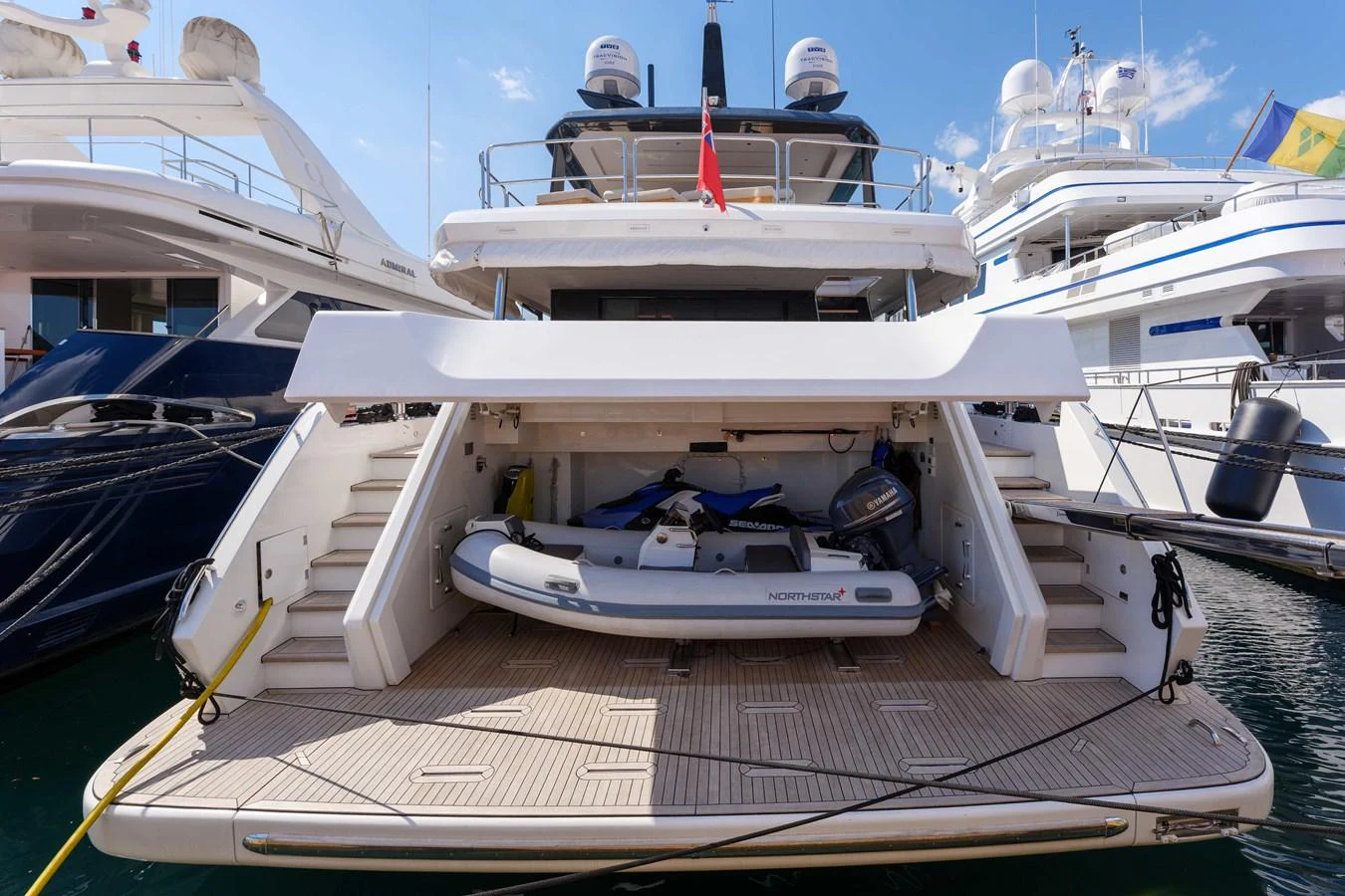 The yacht's tender is neatly stored in the aft garage, ready for quick deployment. aboard 2024 SIRENA 88 Yacht for Sale