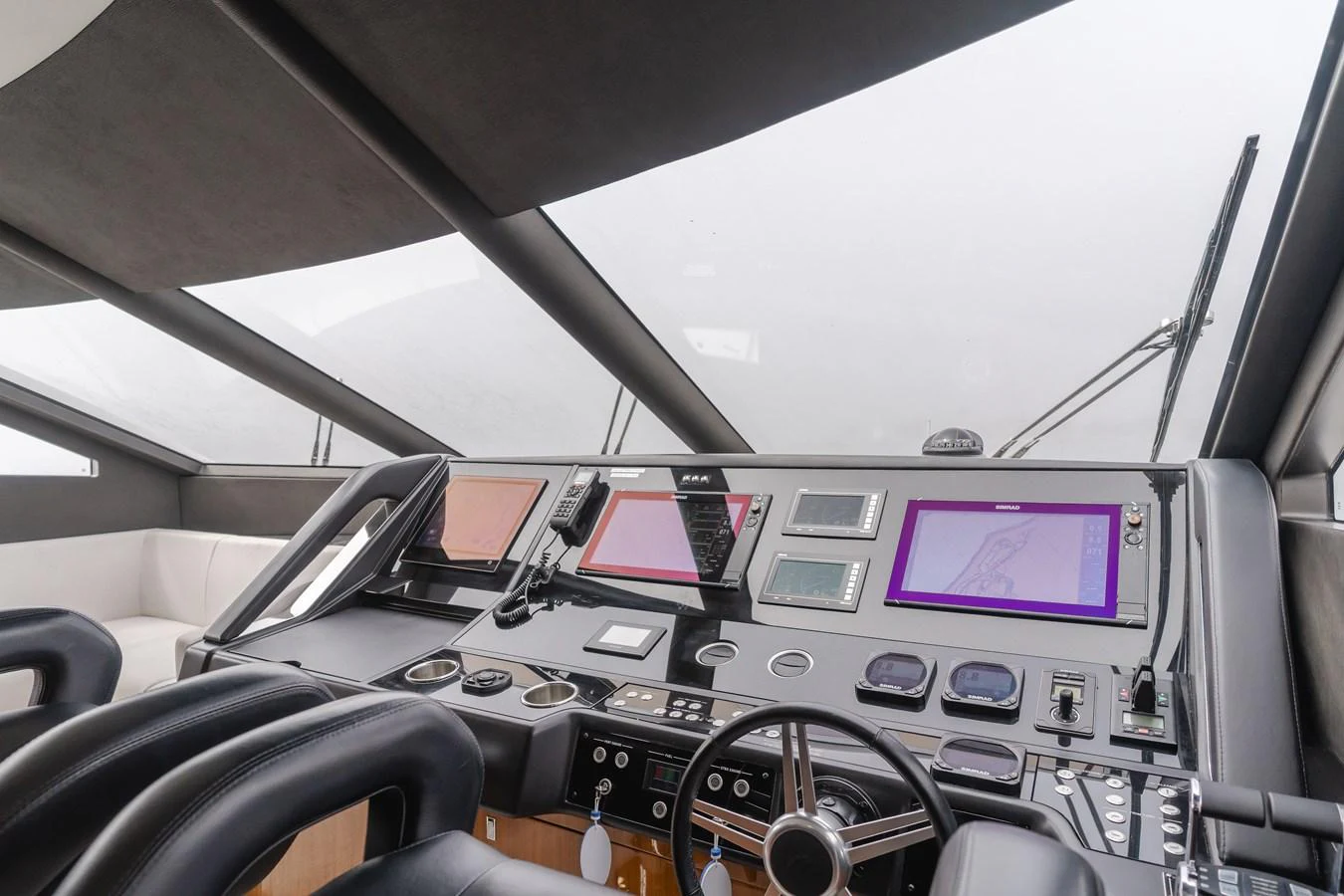 The helm station features advanced navigation equipment and a sleek, modern design. aboard AGUA RANCHO Yacht for Sale