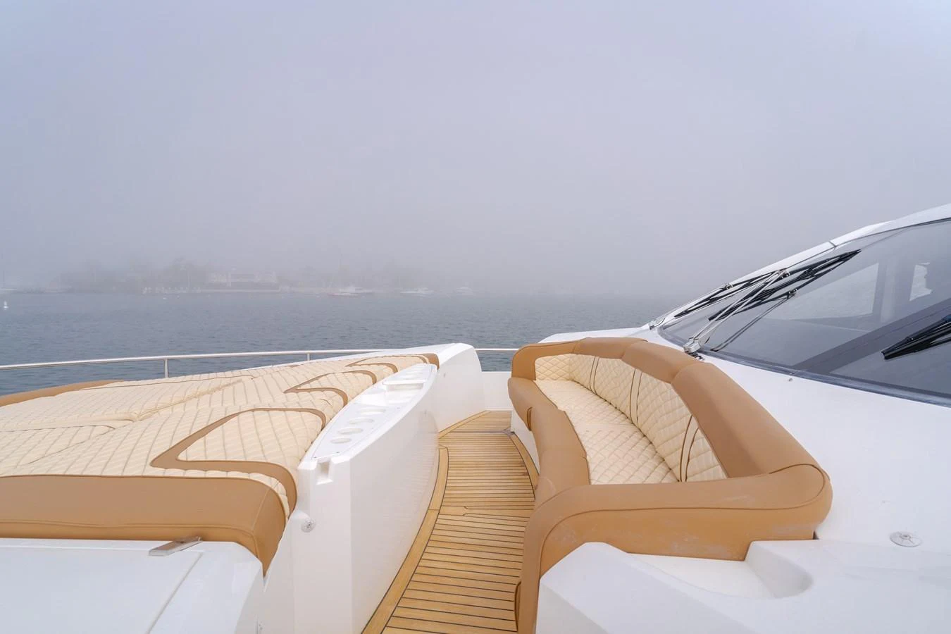 The yacht's foredeck features plush seating and sun pads, perfect for relaxation. aboard AGUA RANCHO Yacht for Sale