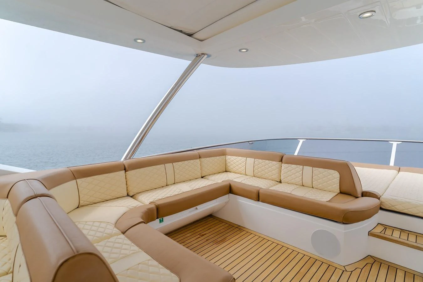 The flybridge features luxurious seating with a panoramic view of the water. aboard AGUA RANCHO Yacht for Sale