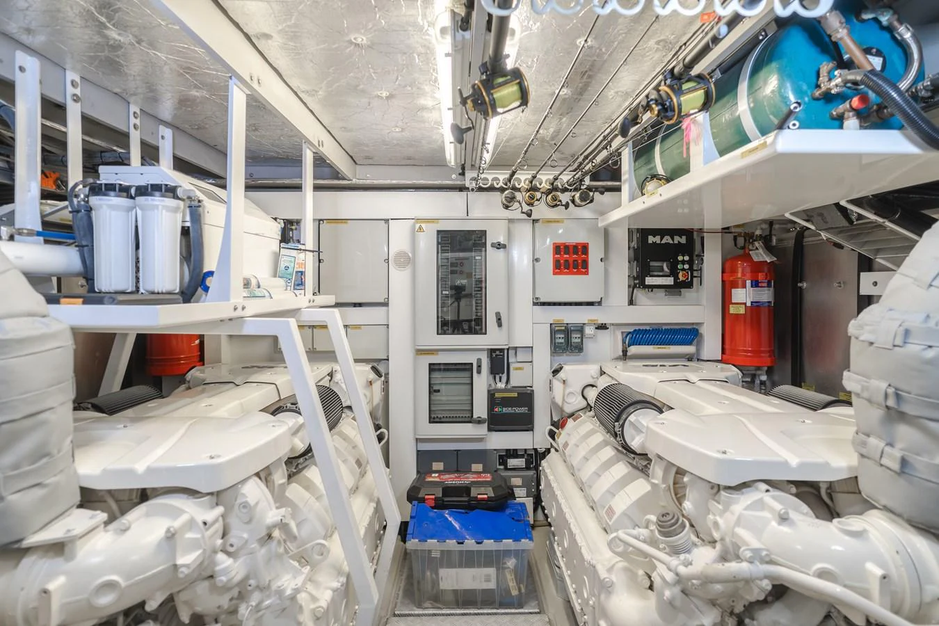 The image showcases a well-organized and clean engine room with advanced machinery and equipment. aboard AGUA RANCHO Yacht for Sale