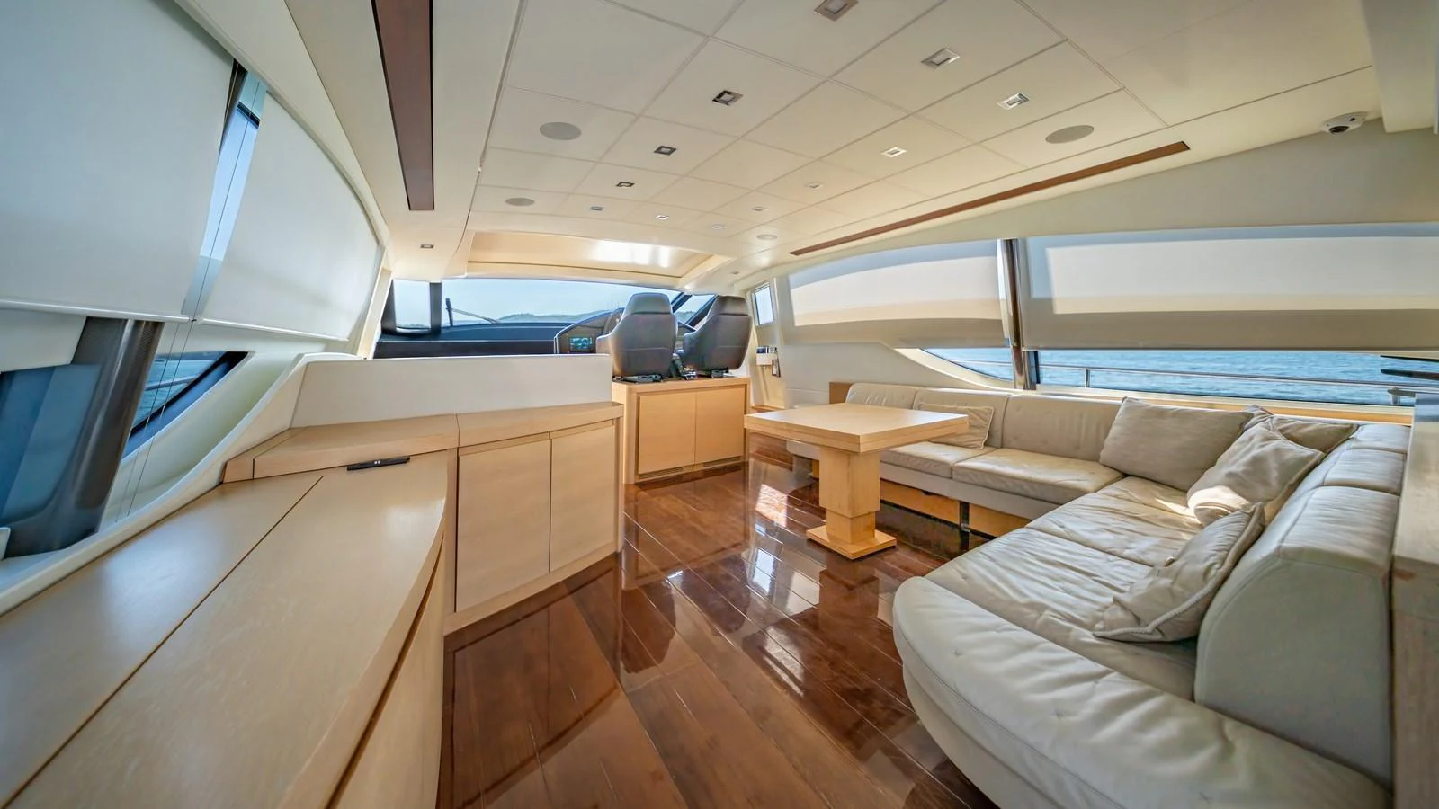 The spacious salon features luxurious seating and panoramic windows, offering a serene and elegant atmosphere. aboard FREEDOM 2 Yacht for Sale