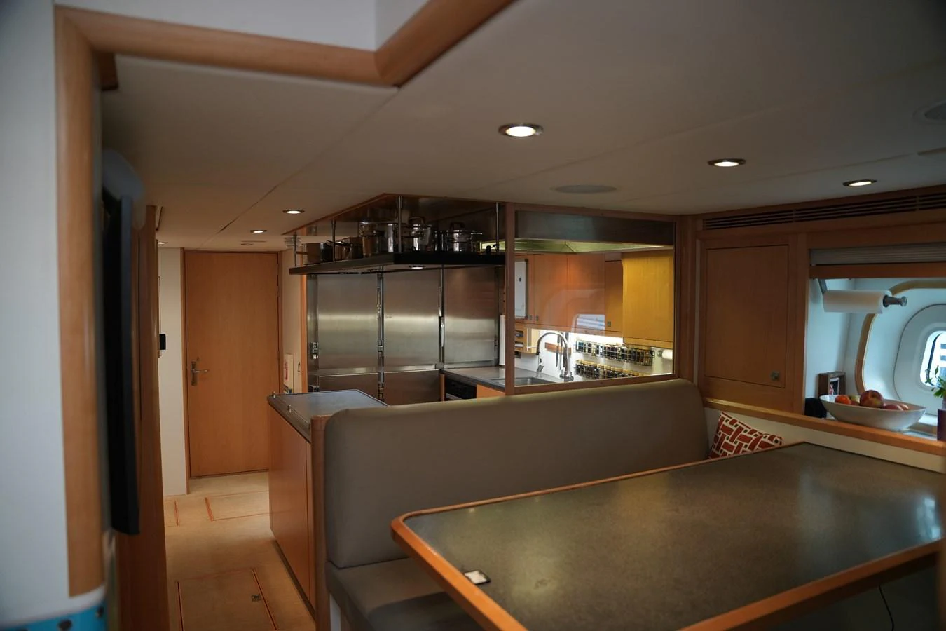 The yacht's galley features a cozy dining area with a well-equipped kitchen. aboard VALQUEST Yacht for Sale