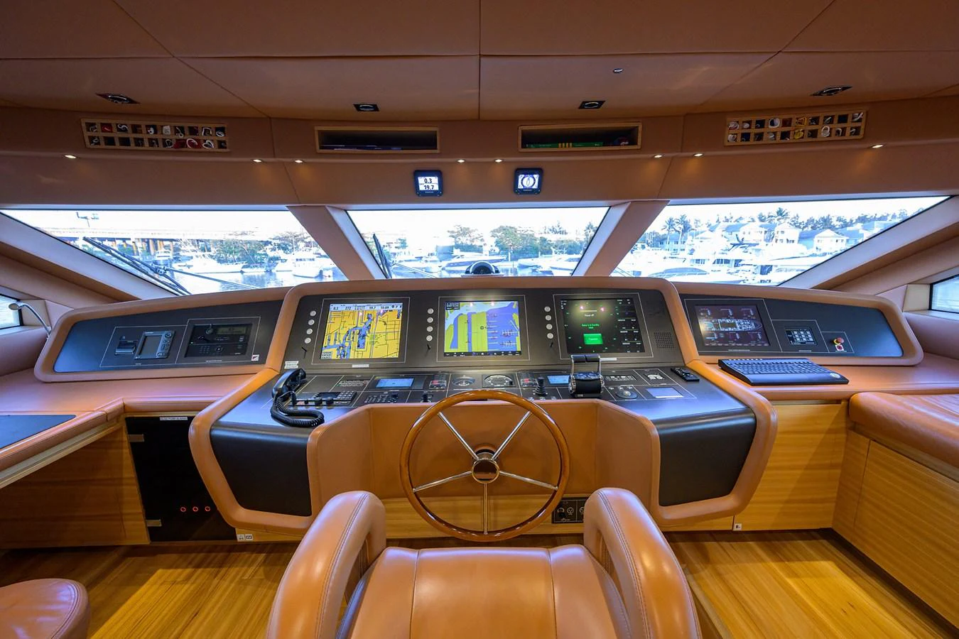 The helm station features advanced navigation systems and luxurious leather seating. aboard CHRISTINA Yacht for Sale
