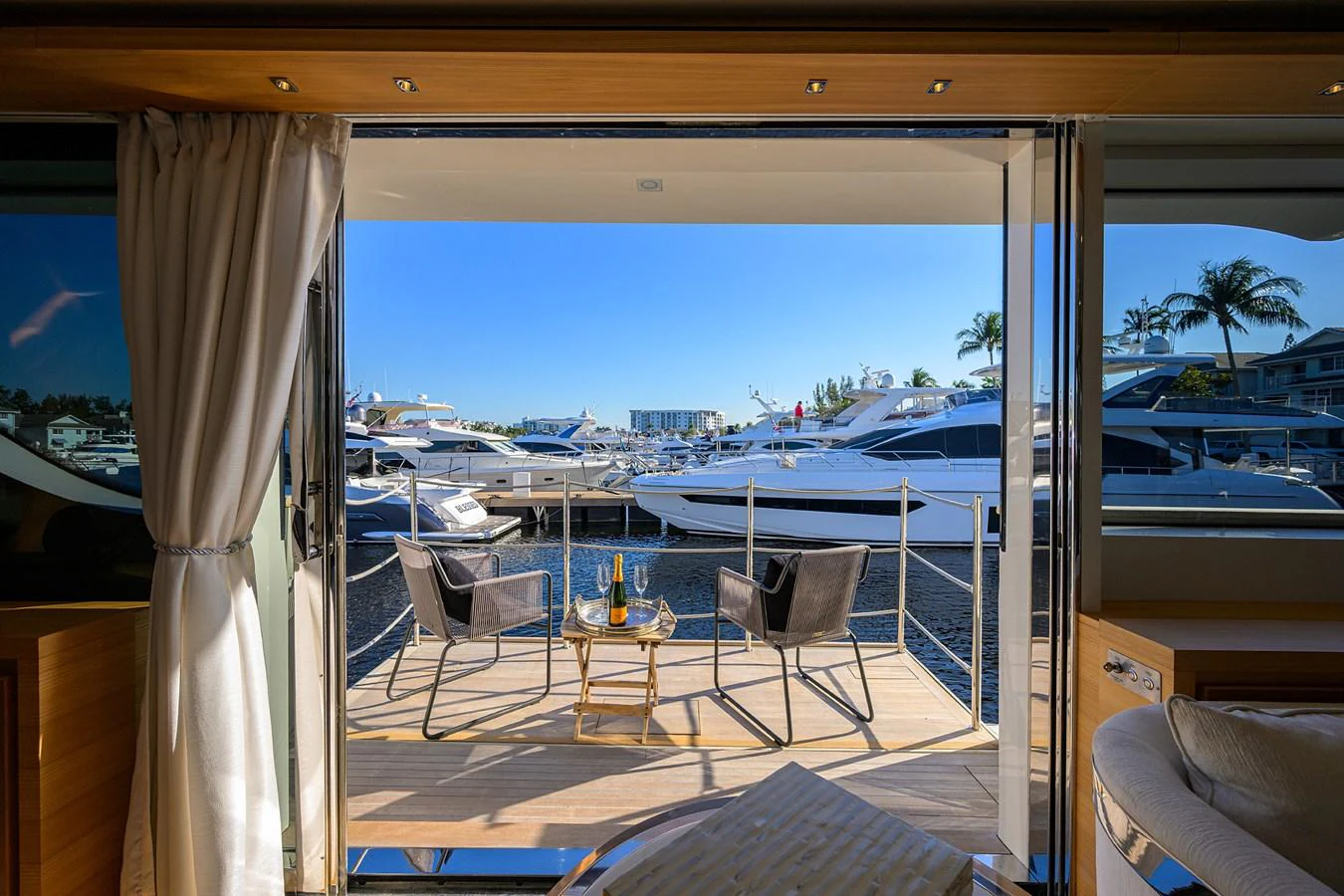 The aft deck offers a serene view of the marina, perfect for enjoying a relaxing drink. aboard CHRISTINA Yacht for Sale