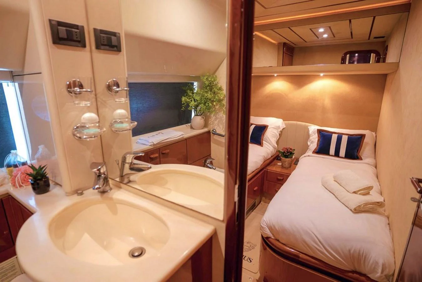 The guest stateroom features twin beds, a vanity, and a cozy ambiance. aboard FERRETTI 70 Yacht for Sale