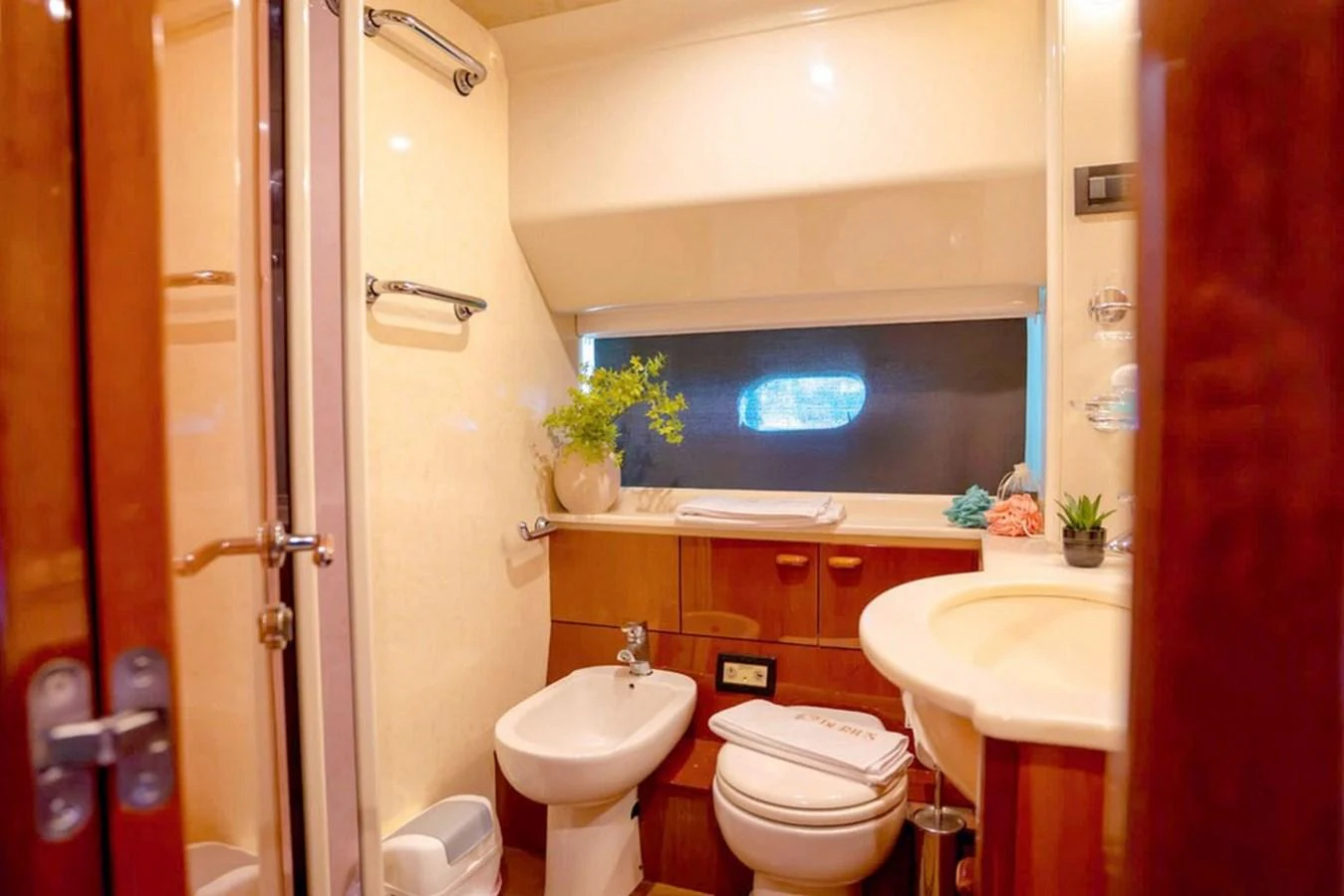 A well-appointed yacht bathroom with modern fixtures and a cozy ambiance. aboard FERRETTI 70 Yacht for Sale