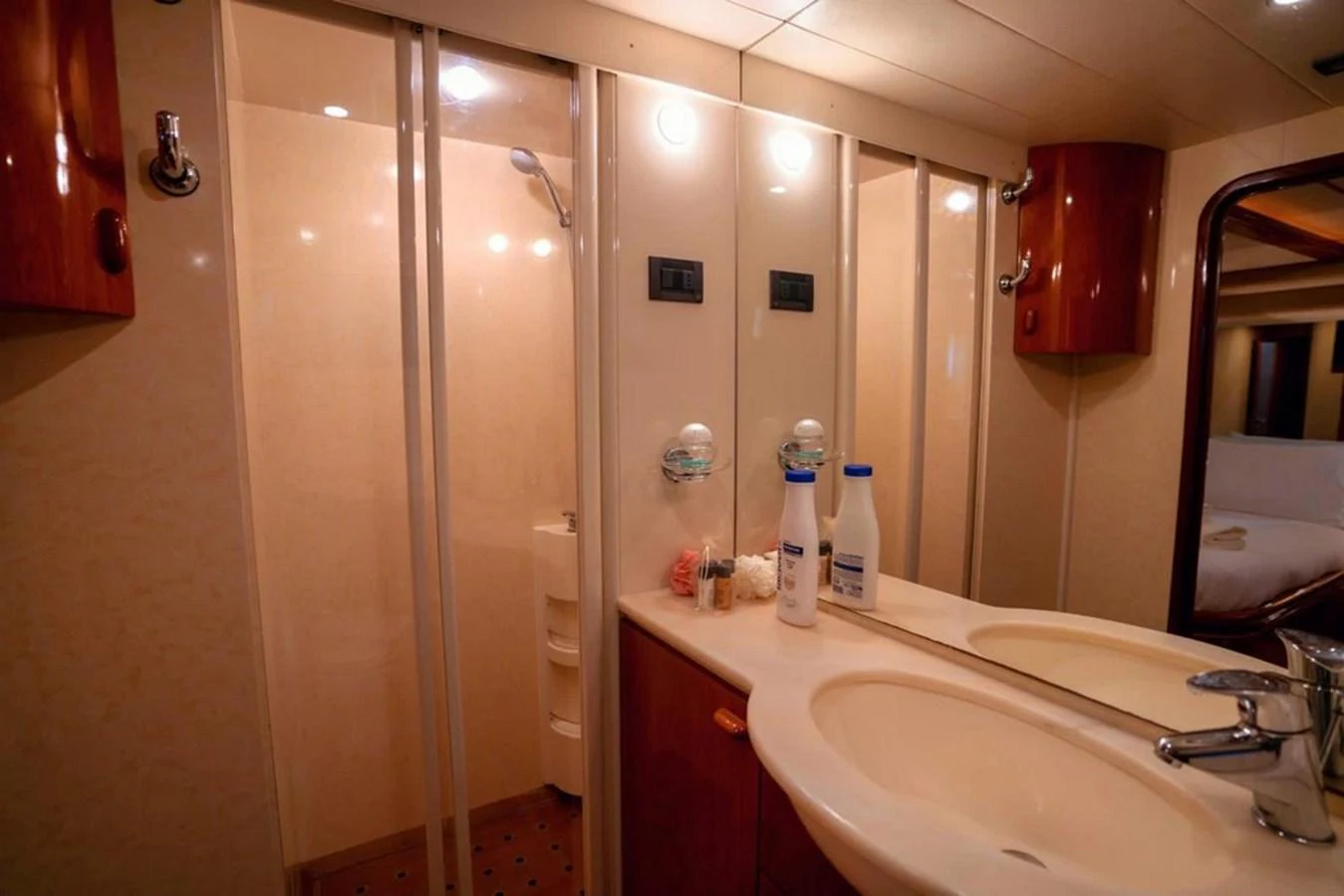 The yacht's bathroom features a sleek design with a spacious shower and modern fixtures. aboard FERRETTI 70 Yacht for Sale