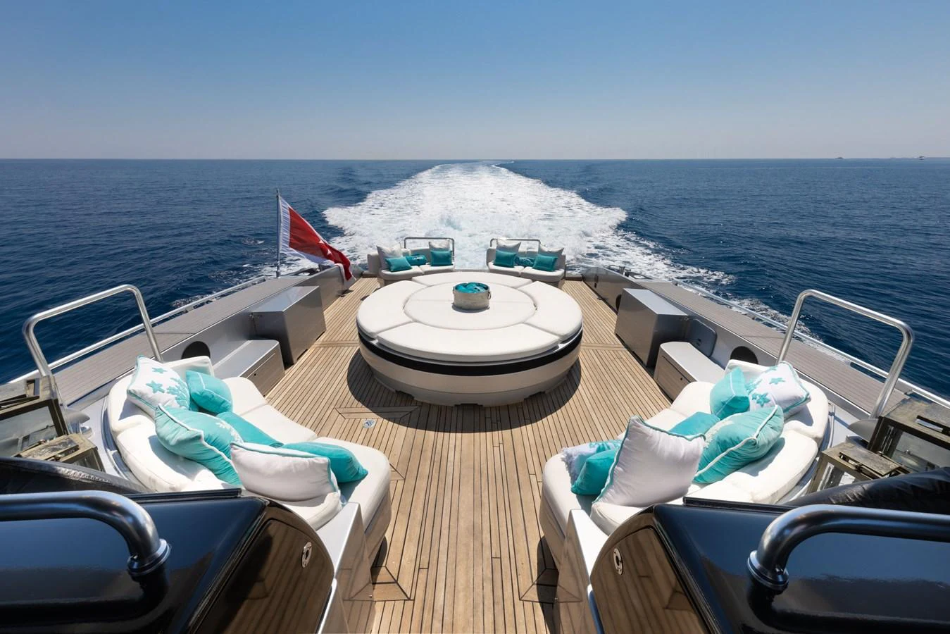 The aft deck offers a luxurious lounging area with plush seating and stunning ocean views. aboard LAUREN V Yacht for Sale