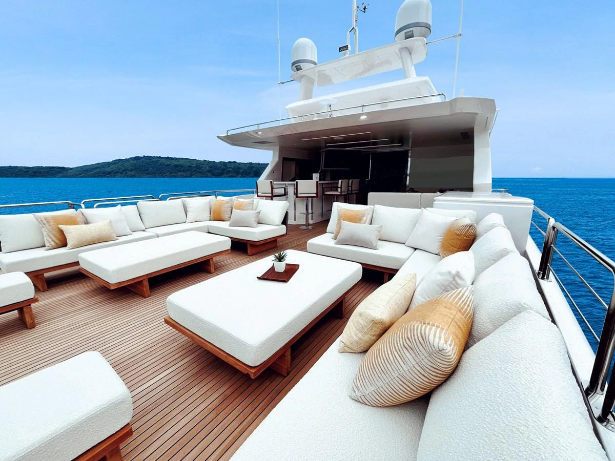 The sundeck offers luxurious lounging with plush seating and stunning ocean views. aboard HORIZON FD90 Yacht for Sale