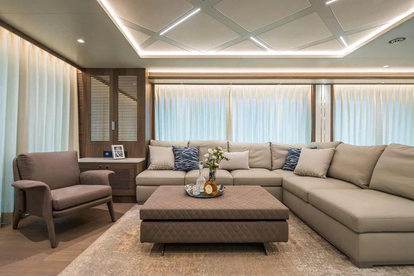 The salon features a spacious and elegant seating area with modern furnishings and soft lighting. aboard HORIZON FD90 Yacht for Sale