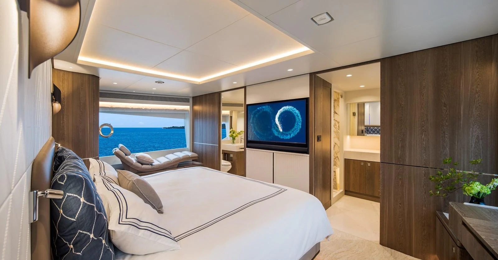 The master stateroom offers a luxurious retreat with a stunning ocean view and modern amenities. aboard HORIZON FD90 Yacht for Sale