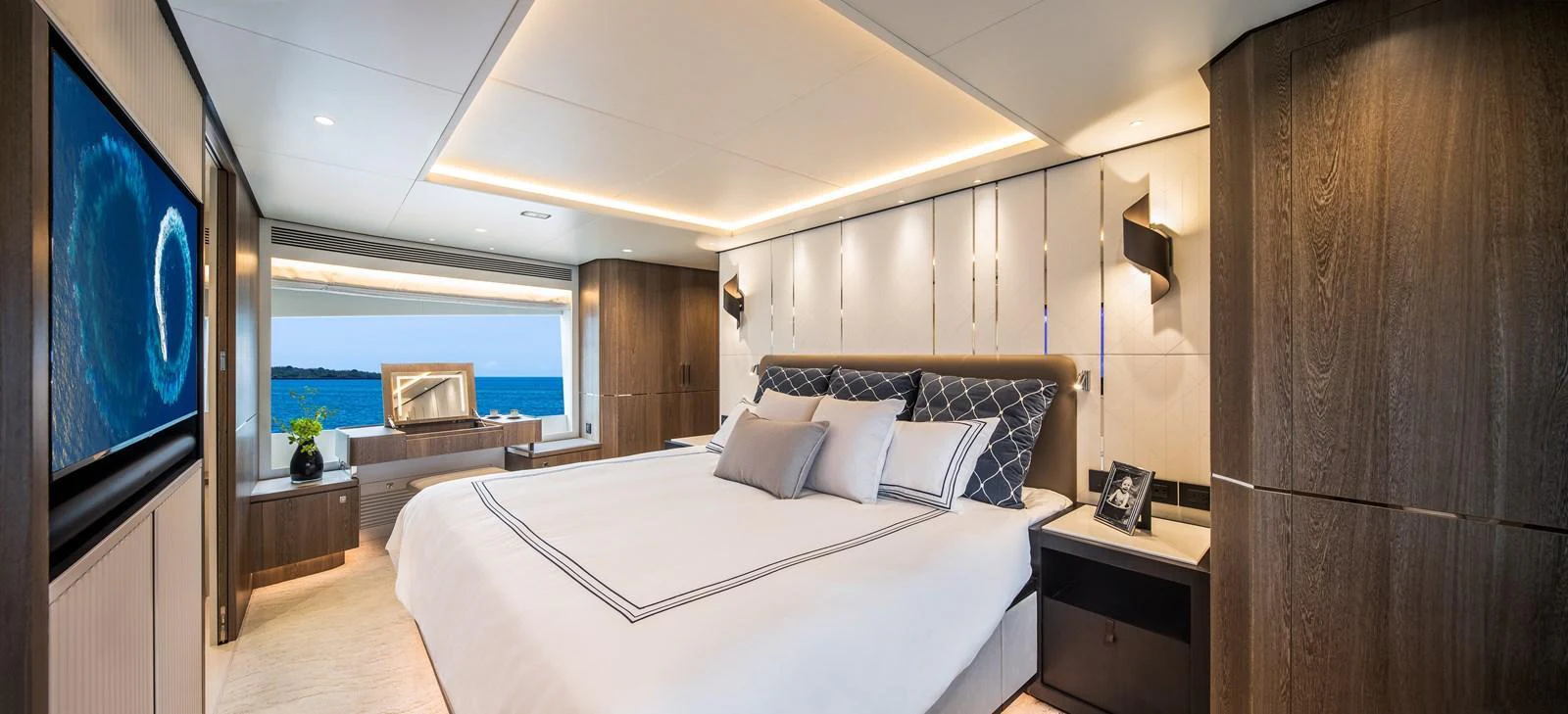 The master stateroom offers a luxurious and spacious retreat with a stunning view of the ocean. aboard HORIZON FD90 Yacht for Sale