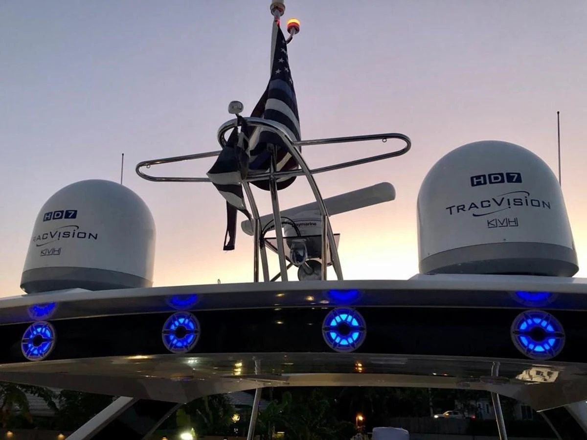 The image showcases the yacht's advanced communication and navigation equipment at dusk. aboard GODSPEED Yacht for Sale